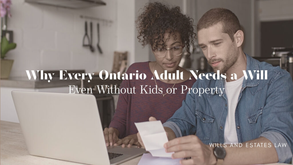 Couple reviewing a document together at a laptop in their kitchen, representing everyday financial planning — Wills & Estates blog by Shaya Law